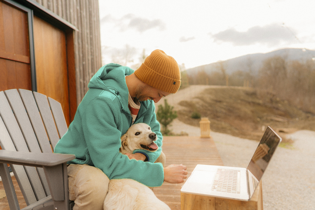 man with dog at beach