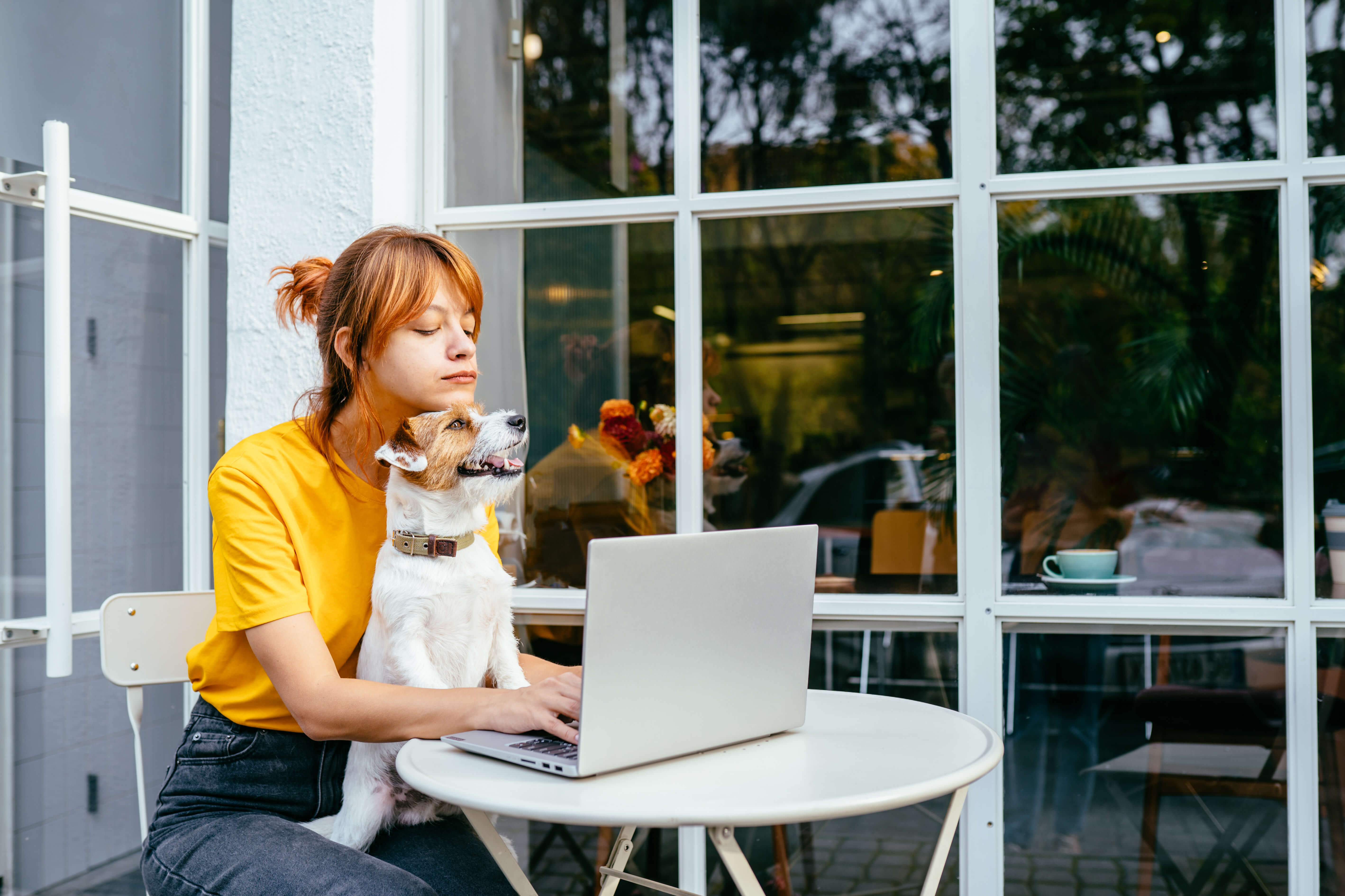woman with dog at desk
